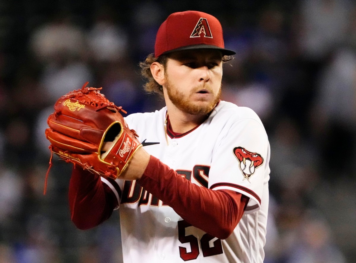 Ryan Nelson starts his delivery to throw a pitch against the Dodgers at Chase Field.